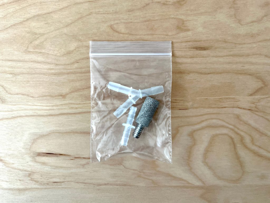2 plastic connectors and stone